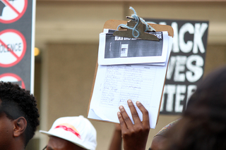 Protesters passed around a petition against the absence of death reports in response to the recent death of Gary Porter.
