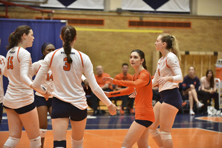 Syracuse celebrates after a point. Though the Orange won, SU only had two aces to Boston College's nine.