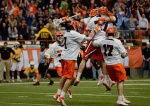 Syracuse celebrates its 17-16 overtime win over Albany on Sunday.