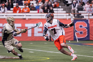 Syracuse attack Derek Maltz blows by a Notre Dame defender. Maltz scored three goals in SU's 11-10 win, and contributed to the attack's dominant effort. 