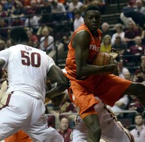 Jerami Grant grabs a rebound in front of Florida State's Michael Ojo. The sophomore forward returned from a back injury and was impressive in the Orange's win over the Seminoles Sunday. 