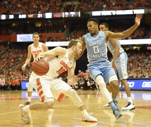 Trevor Cooney takes a dribble with his right hand. He finished with a season-high 27 points, but the Orange still lost its fourth ACC contest in as many games.