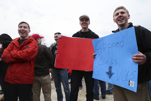 College students supporting Trump hold signs on Inauguration Day in Washington, D.C. 