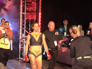 Colleen Schneider walks toward the cage right before her fight with Kate Jackson at the Turning Stone Resort Casino Event Center on Friday night