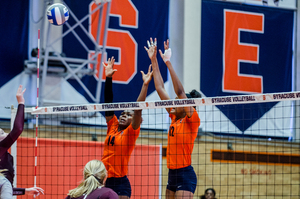 Jalissa Trotter (14), a junior Trotter, goes up for a ball in action last season at the Women's Building. 