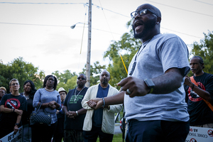 Pastor Nitch Jones addresses attendees of a prayer vigil on Friday, Sept. 21.