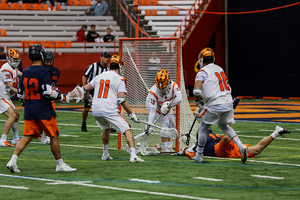 Austin Fusco (left) and Tyson Bomberry (right), pictured earlier this season against Virginia, defending a shot. 