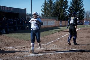 Lailoni Mayfield touches home plate.