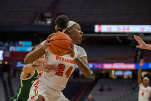 Dariauna Lewis looks for a pass during Syracuse's early season matchup with LeMoyne. Lewis recorded 13 double-doubles in her lone year with the Orange