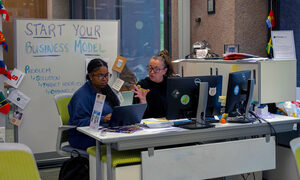 Traci Geisler, the director of the Blackstone LaunchPad at Syracuse University, meets with a student. In the week leading to ‘Cuse Tank, staff members work with students individually to perfect their business pitches.