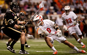 Kenny Nims dodges around an Army defender Friday night during No. 2 Syracuse's 17-6 win over the Black Knights at the Carrier Dome. Senior attack Nims led the Orange with three goals and three assists enroute to SU's second-straight win.  