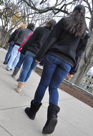 Penn State students 'slow walk' in front of Old Main to encourage fellow students to slow down and remember that the scandal is more about the victims than high-ranking university officials.