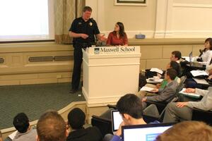 (From left) Joe Shanley and Jen Horvath, DPS Corporal and Public Information Officer, respectively, spoke to SA members about safety protocols and services at Monday nights meeting.