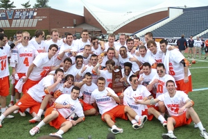 Syracuse celebrates winning the Big East tournament championship after defeating St. John's, 12-4, on Saturday.