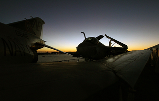 A jet is seen during sunset on board the USS Midway Museum after the Battle on the Midway basketball game between the Syracuse Orange and the San Diego State Aztecs on Sunday.