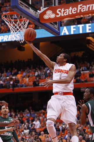 Michael Carter-Williams comes up from the baseline to attempt a layup.