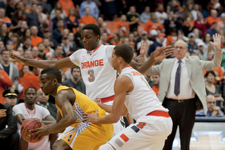 (From left) Jerami Grant and Michael Carter Williams double team an Alcorn State player.