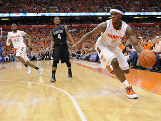 C.J. Fair controls the ball in the left-hand corner.