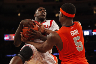 Louisville's Montrezl Harrell (#24) secures an offensive rebound against C.J. Fair.