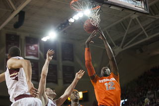 Baye Moussa Keita goes up for a rebound. Keita grabbed three rebounds, all offensive, in the game.  