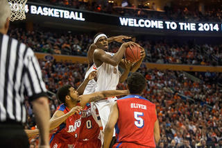 Fair is tied up by a group of defenders trying to corral a loose ball. 