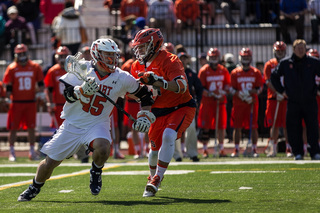 Hobart's Taylor Vanderbeek takes on an SU midfielder.