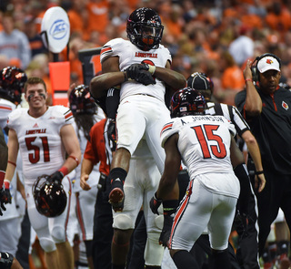 A trio of Cardinals celebrate during their victory over the Orange.