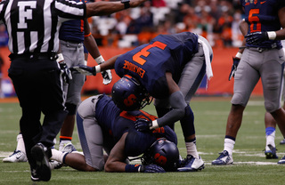 Durell Eskridge consoles Davis, who dropped a potential interception. 