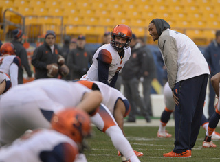 Hunt lines up opposite sophomore quarterback Mitch Kimble during pregame warm-ups.