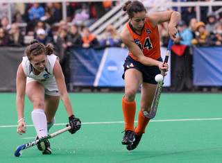 Laura Hurff controls a bouncing ball past a UConn defender. The SU freshman is part of a young returning core for the Orange.