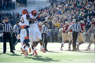 Safety Ritchy Desir and linebacker Dyshawn Davis celebrate after a defensive stop. 