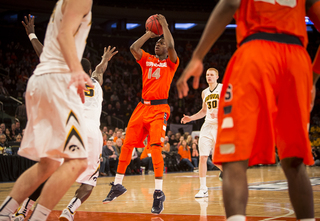 Joseph elevates for a free-throw-line jumper as an Iowa defender tries to get a hand in his face.