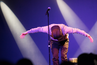 Jin takes a bow at the end of his performance. 