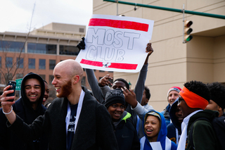 A demonstrator holds a sign during the march on Friday morning. 