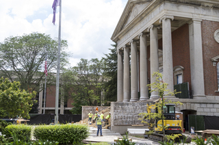 Construction crews work on the new steps that lead to the entrance of Hendricks Chapel. Photo taken by July 11, 2017