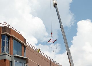 Work to replace the Center for Science and Technology's roof is more than halfway complete. Photo taken Aug. 1, 2017