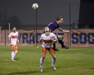 Freshman forward Petter Stangeland heads the ball. 