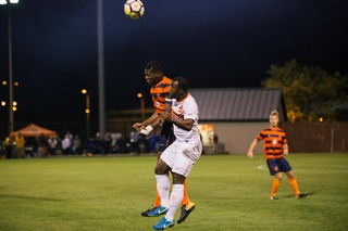 Miller jumps for a header.