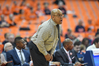 SU head coach Quentin Hillsman yells onto the court for SU.