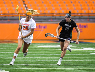 Julie Cross sprints past a Loyola defender.