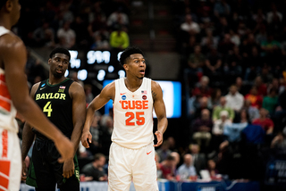 Battle looks over to the SU bench late in the game, seeking advice on whether he should foul. 