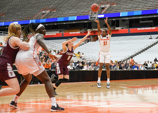 Cooper shoots a 3-pointer.