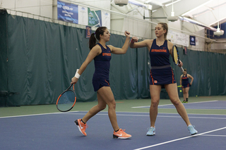 Miranda Ramierez and Gabriella Knutson embrace after a point.