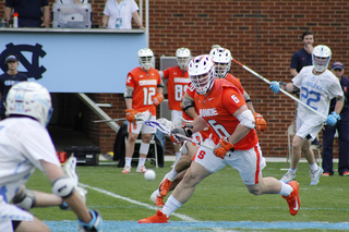 Luke Schwasnick runs the ball up the field