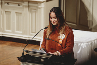 Scholar Allison Westbrook gives a speech as the representative of the 35 students.