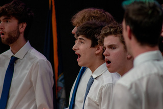 The sounds of OttoTunes ring through the K. G. Tan Auditorium of the National Veterans Resource Center. Three of the SU a capella groups sang songs dedicated to the victims of the Pan Am Flight 103 terrorist attack