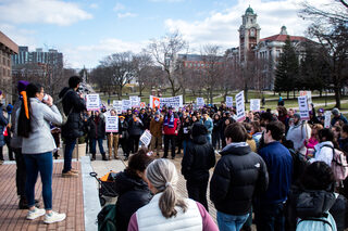 Graduate worker Aditya Srinivasan tells the crowd about SU’s subpar financial support in his move from India to Syracuse. On Feb. 8, Syracuse Graduate Employees United held a march to recognize the necessity of forming a graduate student union, which concluded in front of Crouse-Hinds Hall administration offices. 